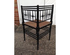 Liberty & Co. An Aesthetic Movement ebonised corner chair and side chair after a design by Ford Maddox Brown. - Thumbnail 3