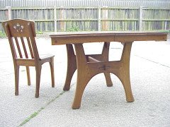 A French Arts & Crafts Oak extending dining table - Thumbnail 1