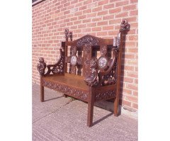 A Celtic Arts & Crafts carved Oak settle with carved dragons to the tops - Thumbnail 3