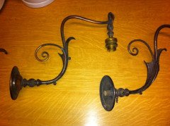 A pair of Arts & Crafts wall lights with floral leaf and scroll work decoration to the arms. - Thumbnail 2