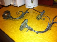 A pair of Arts & Crafts wall lights with floral leaf and scroll work decoration to the arms. - Thumbnail 3