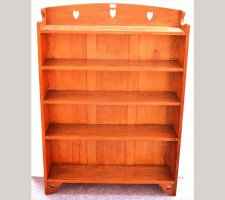 Liberty & Co. A good Arts & Crafts Oak bookcase with stylised hearts to the top and to the base. - Thumbnail 1