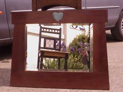 An Arts & Crafts mahogany style mirror with subtle angular form with a light blue Ruskin Heart to the top - Thumbnail 1