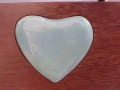An Arts & Crafts mahogany style mirror with subtle angular form with a light blue Ruskin Heart to the top - Thumbnail 4