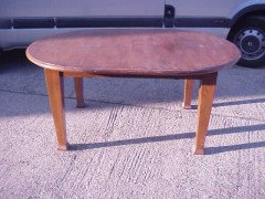 An Arts and Crafts extending dining table with curved ends - Thumbnail 1