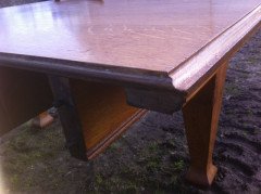 A fourteen seat Arts & Crafts Oak 'D' end extending dining table with four extra leaves. - Thumbnail 7