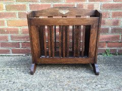 Liberty & Co. Arts & Crafts Oak Canterbury with stylised cut-outs to the ends. - Thumbnail 1