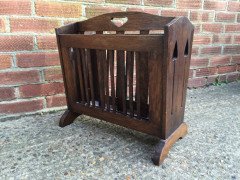 Liberty & Co. Arts & Crafts Oak Canterbury with stylised cut-outs to the ends. - Thumbnail 3