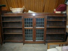 Liberty & Co. A quality Arts & Crafts 1/4 sawn Oak breakfront bookcase - Thumbnail 1