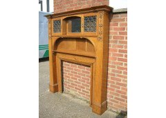 An Arts & Crafts Oak fire surround with egg and dart mouldings central mirror - Thumbnail 2