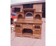An Arts & Crafts Oak sideboard with engraved copper metalwork - Thumbnail 1