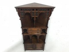 Liberty & Co. A walnut corner cupboard in the Moorish style. - Thumbnail 2