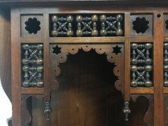 Liberty & Co. A walnut corner cupboard in the Moorish style. - Thumbnail 4