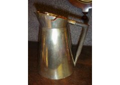Dr. Christopher Dresser, In the manner of. A Silver Plated Hot Water Jug with Ebony Angular Handle