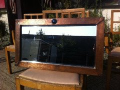 Liberty & Co. An Arts & Crafts copper mirror with blue enamel roundel - Thumbnail 1