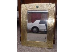 Liberty & Co. A large Arts & Crafts brass mirror with Ruskin roundels. - Thumbnail 1