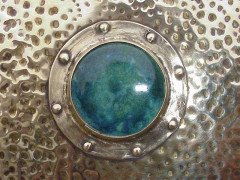 Liberty & Co. A large Arts & Crafts brass mirror with Ruskin roundels. - Thumbnail 2
