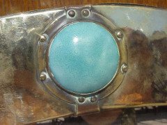 Liberty & Co. A brass mirror with four Ruskin ceramic discs rivetted into place. - Thumbnail 2