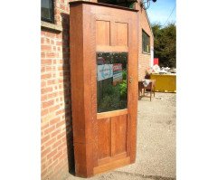 A quality tall Arts & Crafts Oak cupboard with central bevelled mirror - Thumbnail 1
