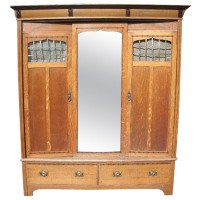 Gillow & Co., Arts & Crafts Oak Treble Wardrobe with Ebony Floral Inlays