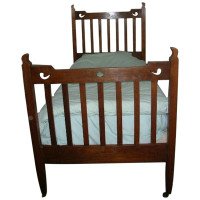 Liberty & Co. Attributed, an Arts & Crafts Oak Bed with Stylized Floral Cut-Outs - Thumbnail 1