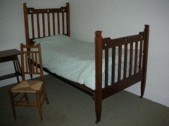 Liberty & Co. Attributed, an Arts & Crafts Oak Bed with Stylized Floral Cut-Outs - Thumbnail 2
