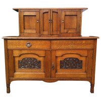 George Walton, Style of. A Small Arts & Crafts Oak Sideboard with Floral Carvings