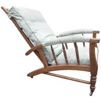 Jas Shoolbred, In the style of Morris & Co., a Reclining Upholstered Armchair
