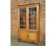 Arts & Crafts Oak Bookcase with Stylised Floral Stain Glass and a Cupboard below - Thumbnail 2