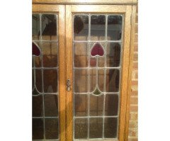 Arts & Crafts Oak Bookcase with Stylized Floral Stain Glass and a Cupboard below - Thumbnail 3