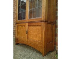Arts & Crafts Oak Bookcase with Stylised Floral Stain Glass and a Cupboard below - Thumbnail 5