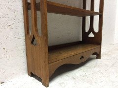 Liberty & Co. Attributed, an Arts & Crafts Oak Bookcase with floral cut-outs - Thumbnail 1