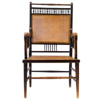 E. W. Godwin. An Anglo-Japanese Ebonised Beech and Caned Armchair - Thumbnail 1