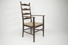 Liberty & Co., Style of C. F. A. Voysey. A Pair of Oak Rush Seat Ladderback Armchairs - Thumbnail 13