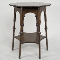 Liberty and Co. An Arts and Crafts oak side or occasional table with a shaped top and molded edges - Thumbnail 1