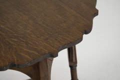 Liberty and Co. An Arts and Crafts oak side or occasional table with a shaped top and molded edges - Thumbnail 12
