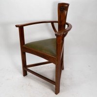 M H Baillie Scott. An Arts & Crafts Walnut Armchair with stylised floral carving - Thumbnail 1