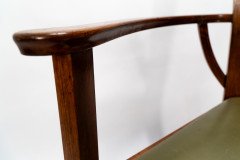 M H Baillie Scott. An Arts & Crafts Walnut Armchair with stylised floral carving - Thumbnail 9