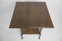 Liberty & Co., attributed. An Arts & Crafts Oak Two-tier Side Table with a Moorish Apron Underneath the Top - Thumbnail 6