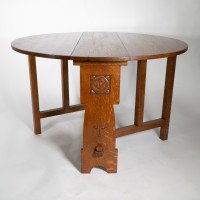 Liberty & Co., An Arts & Crafts 1/4 Salon Oak Drop Leaf Table with Stylised Floral Carved Decoration - Thumbnail 1