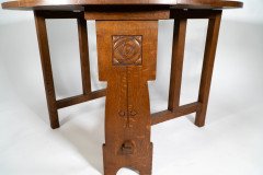 Liberty & Co., An Arts & Crafts 1/4 Salon Oak Drop Leaf Table with Stylised Floral Carved Decoration - Thumbnail 12