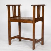 An Arts and Crafts oak piano stool with raised sides - Thumbnail 1