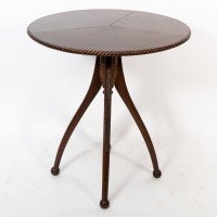 Lambs of Manchester attr. A fine Aesthetic Movement walnut circular wine table - Thumbnail 1