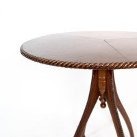 Lambs of Manchester attr. A fine Aesthetic Movement walnut circular wine table - Thumbnail 5