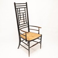 James Plucknett Attributed, probably for Collier & Plucknett. An Exaggerated High Back Anglo-Japanese Ebonised Armchair