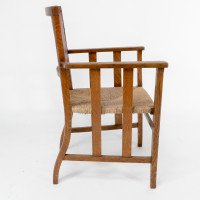 Liberty & Co. An Arts & Crafts Rush Seat Armchair with a Shaped Back - Thumbnail 4