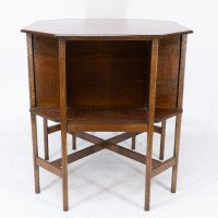 Ambrose Heal's attri. An Arts & Crafts Oak octagonal book table with eight legs - Thumbnail 6