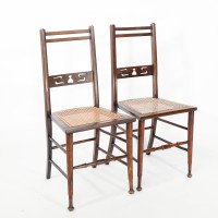 A Pair of Arts & Crafts Side Chairs with Stylised Tulip Cut-outs to the Back