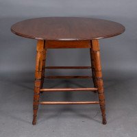 Collinson & Lock, attributed. A Walnut Centre Table with Incised Circular Details to the Legs - Thumbnail 4