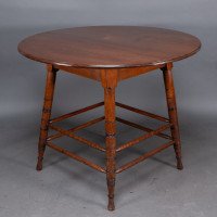 Collinson & Lock, attributed. A Walnut Centre Table with Incised Circular Details to the Legs - Thumbnail 7